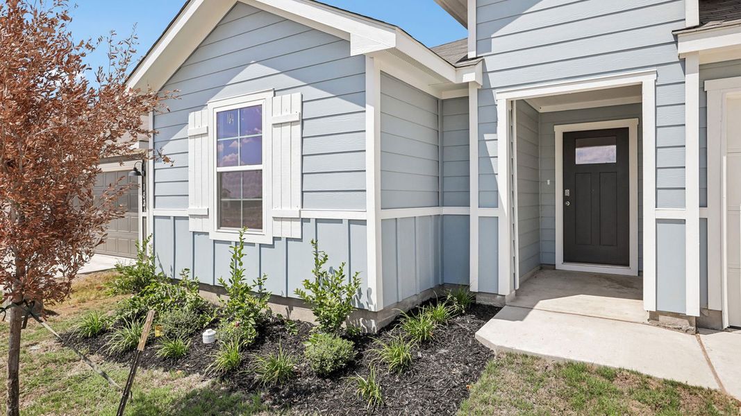 Exterior details and patio area of a home in Prairie Lakes, Buda (Image 3).