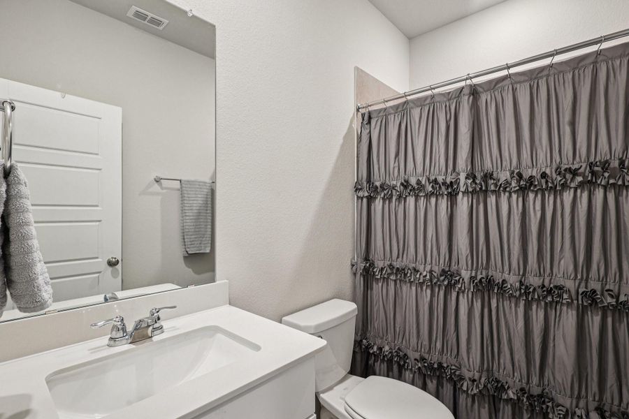 Furnished interior view inside a new home in Sundance Cove - Classic Series, Crosby (Image 30). Furnished interior view inside a new home in Sundance Cove - Classic Series, Crosby (Image 30).