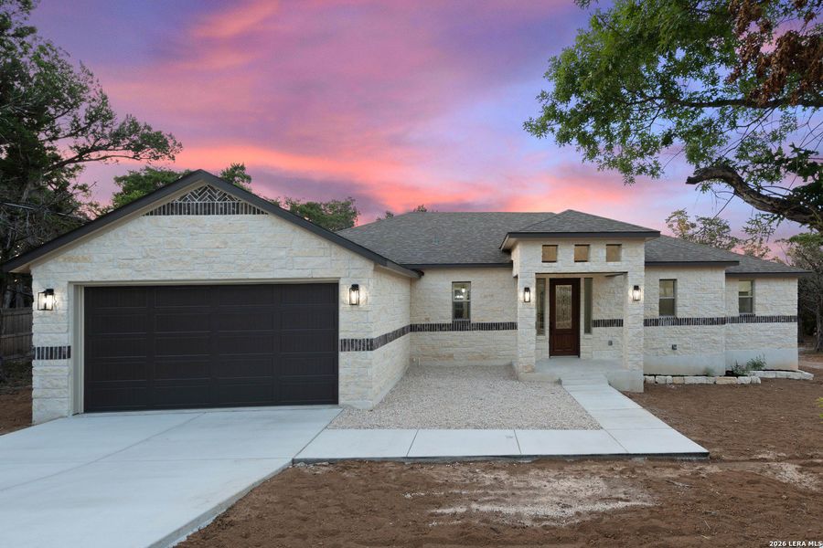 Front exterior of a new home in , Spring Branch, TX, highlighting curb appeal (Image 2). Front exterior of a new home in , Spring Branch, TX, highlighting curb appeal (Image 2).