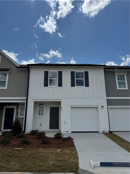 Front exterior of a new home in The Emery, Villa Rica, GA, highlighting curb appeal (Image 1). Front exterior of a new home in The Emery, Villa Rica, GA, highlighting curb appeal (Image 1).