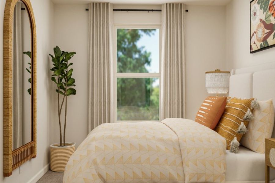 A bedroom with a large window.