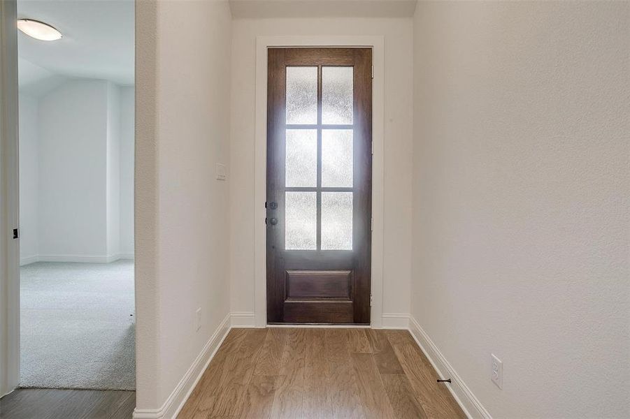 Doorway featuring light hardwood / wood-style flooring