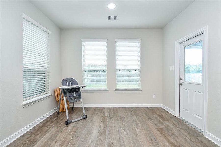 Breakfast room with door to the covered patio and great light.