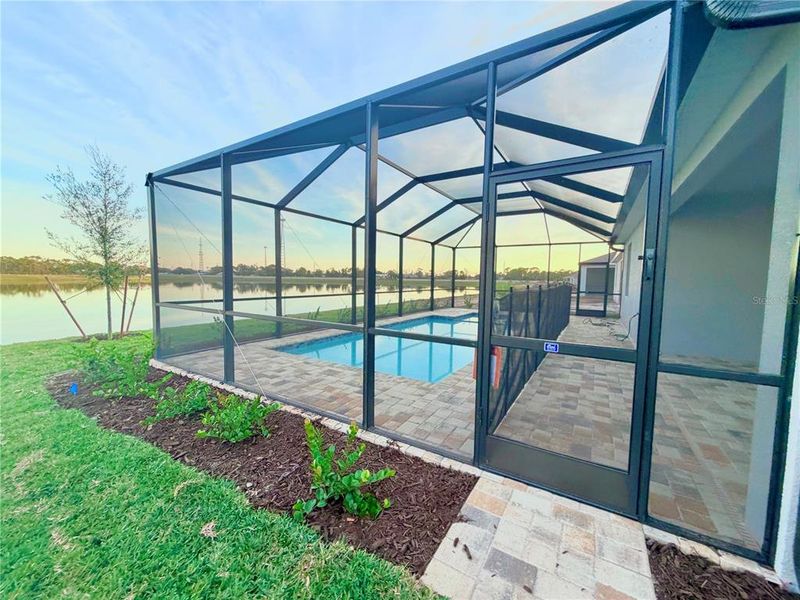Exterior details and patio area of a home in Island Lakes at Coco Bay, Englewood (Image 3).