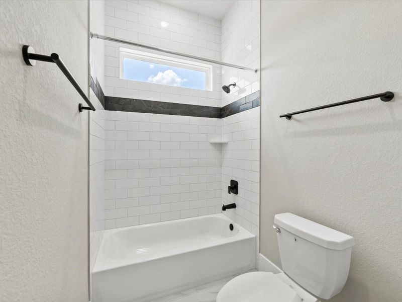 Jack in Jill bathroom features a tub/ shower combo. Jack in Jill bathroom features a tub/ shower combo.