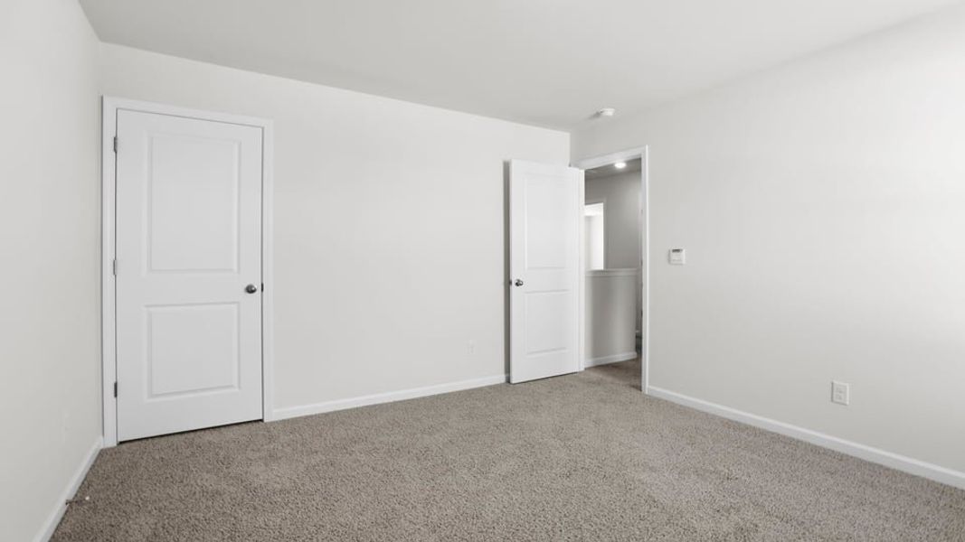 Spacious, unfurnished interior of a new home in Durbin Meadows Traditions, Fountain Inn (Image 28).