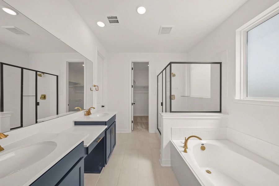 Primary bath. "Note: Sample product photo. Actual exterior and interior selections may vary by homesite. Photo may be virtually staged