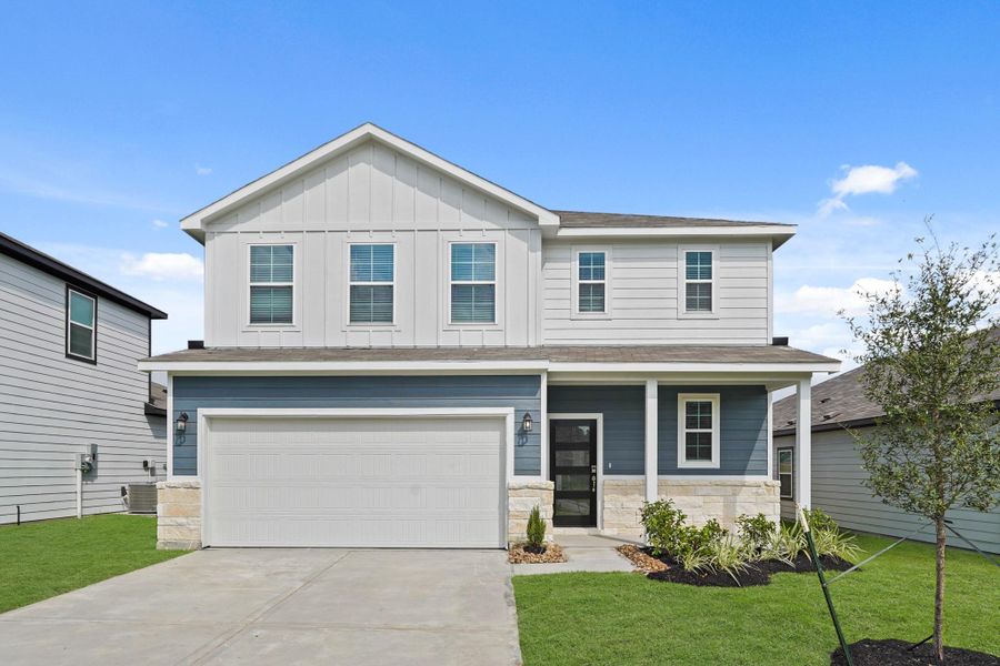Front exterior of a new home in Reveille Estates, Bryan, TX, highlighting curb appeal (Image 2).
