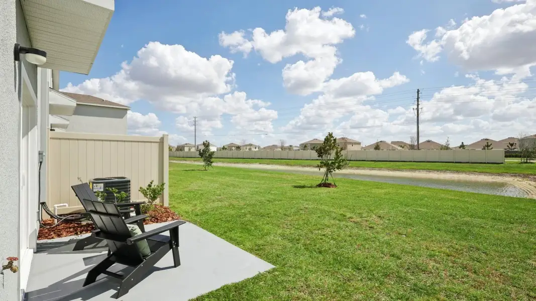 Exterior details and patio area of a home in Towns at Woodsdale, Wesley Chapel (Image 4).