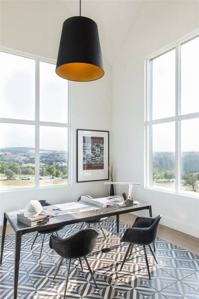 Office space featuring light wood-style floors and baseboards