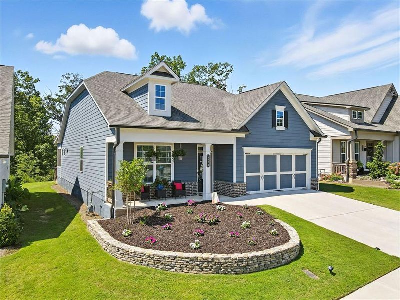 Front exterior of a new home in Hickory Bluffs, Canton, GA, highlighting curb appeal (Image 22). Front exterior of a new home in Hickory Bluffs, Canton, GA, highlighting curb appeal (Image 22).