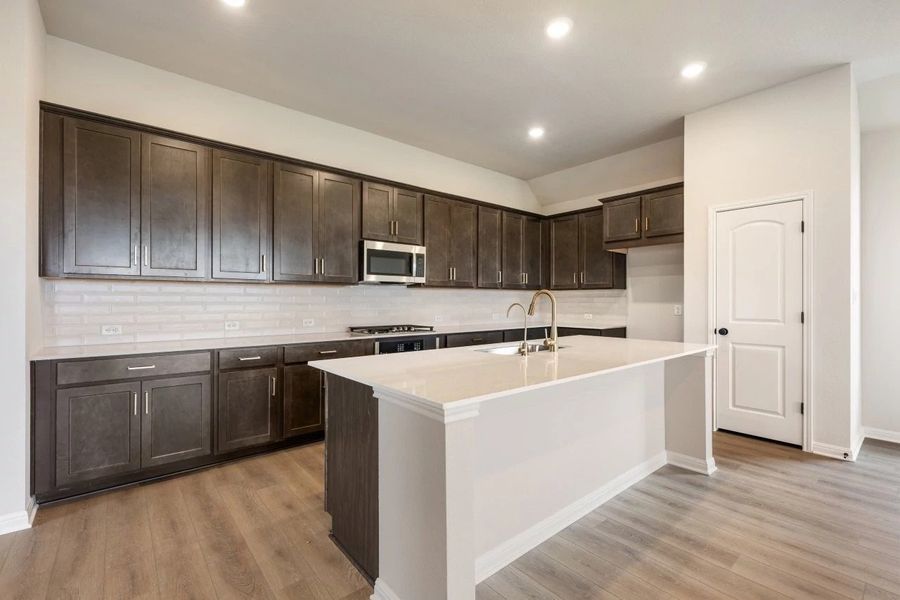 Furnished interior view inside a new home in The Colony 50s, Bastrop (Image 8).