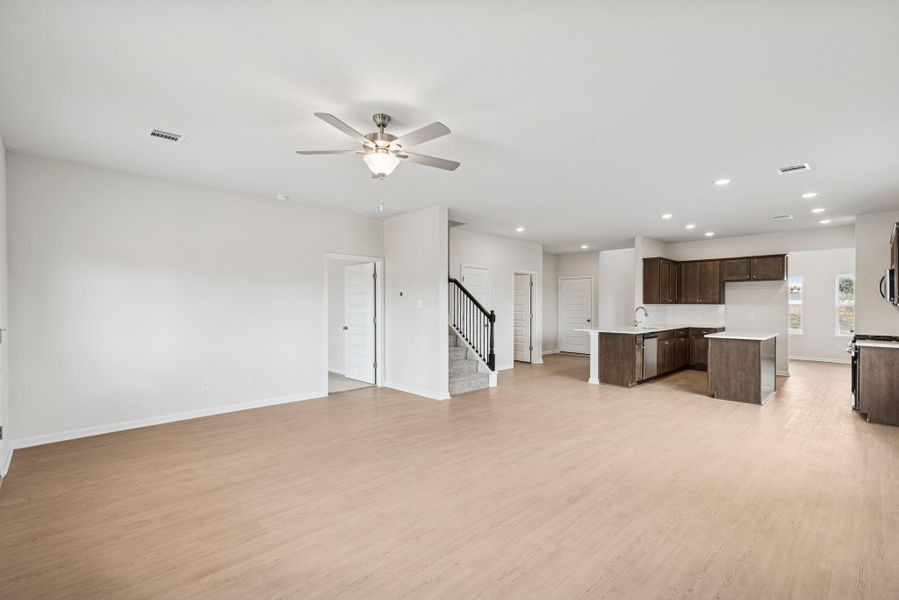 The Georgetown II- Family Room into Breakfast Area and Kitchen. Home under construction, photo used for illustrative purposes only, colors and options will vary.