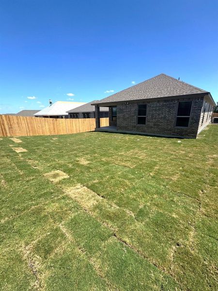 Front exterior of a new home in Overlook Ranch, Georgetown, TX, highlighting curb appeal (Image 22). Front exterior of a new home in Overlook Ranch, Georgetown, TX, highlighting curb appeal (Image 22).