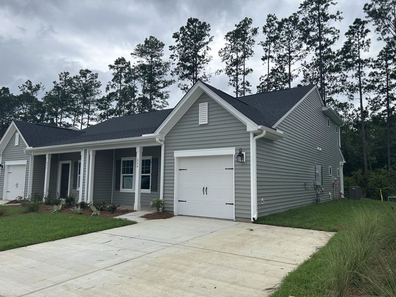 Front exterior of a new home in Hammock Walk at Nexton, Summerville, SC, highlighting curb appeal (Image 23). Front exterior of a new home in Hammock Walk at Nexton, Summerville, SC, highlighting curb appeal (Image 23).