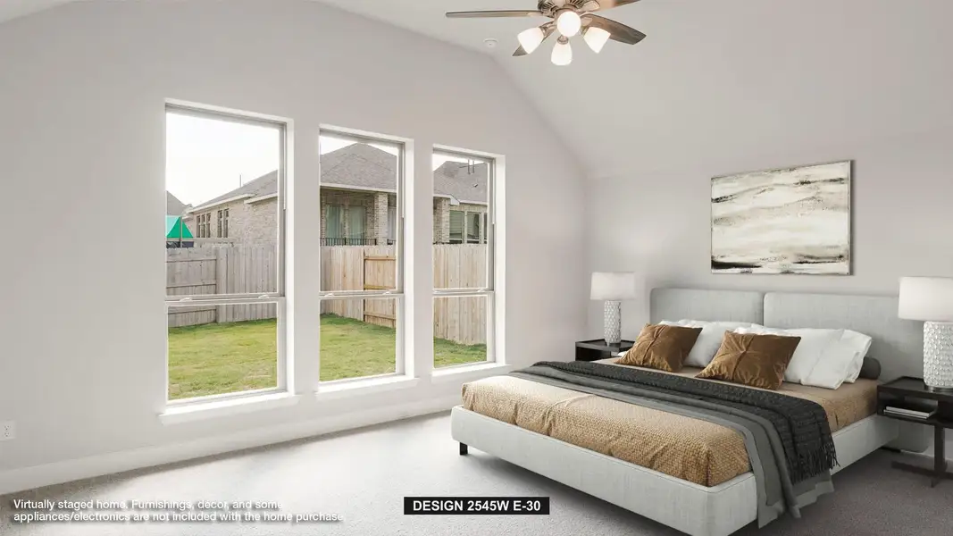 Bedroom with carpet flooring, vaulted ceiling, and ceiling fan