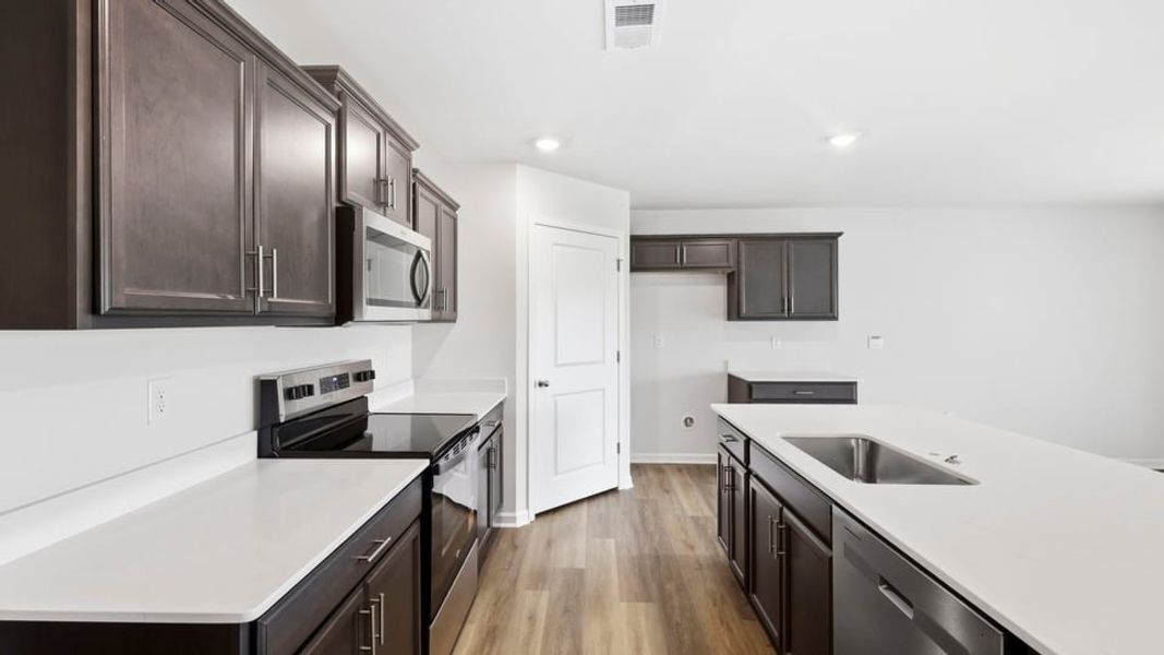 Furnished interior view inside a new home in Lakestone, Woodruff (Image 9).