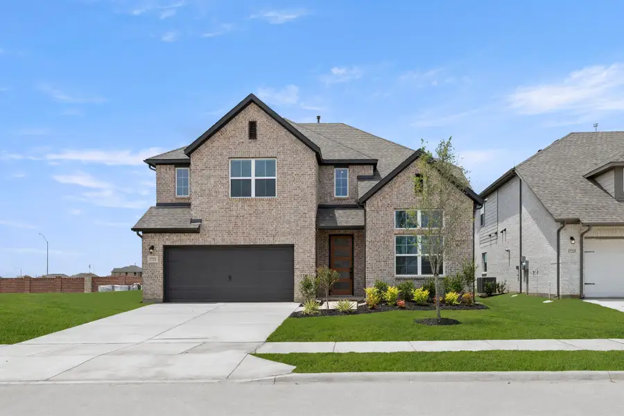 Representative exterior photo of a completed home built from the Courage by Rockwell Homes in Anna Ranch, Anna, TX (Image 1). Representative exterior photo of a completed home built from the Courage by Rockwell Homes in Anna Ranch, Anna, TX (Image 1).