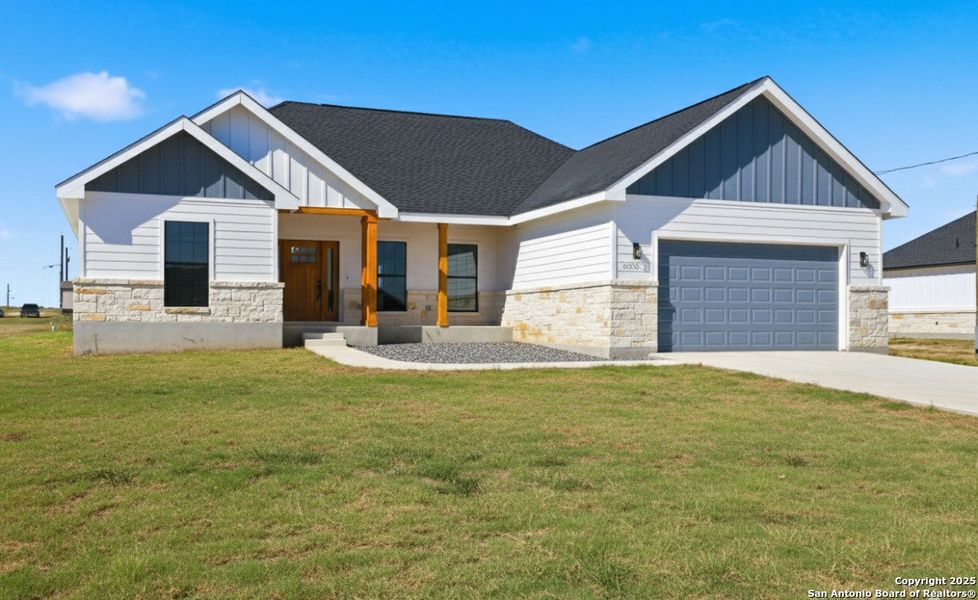 Front exterior of a new home in , Atascosa, TX, highlighting curb appeal (Image 1). Front exterior of a new home in , Atascosa, TX, highlighting curb appeal (Image 1).