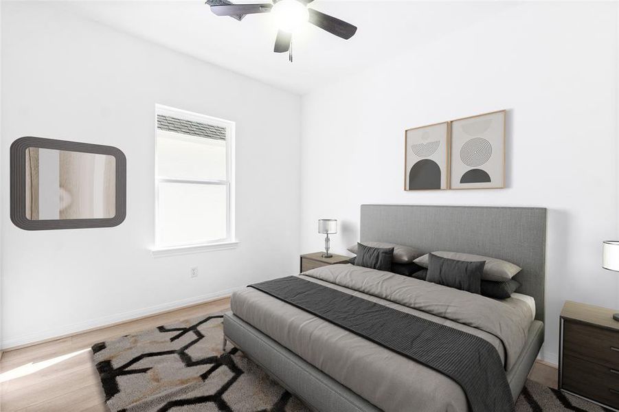 The first secondary bedroom features a large window for ample natural light and a spacious closet for added convenience. (Photo may be enhanced and may include virtual staging)