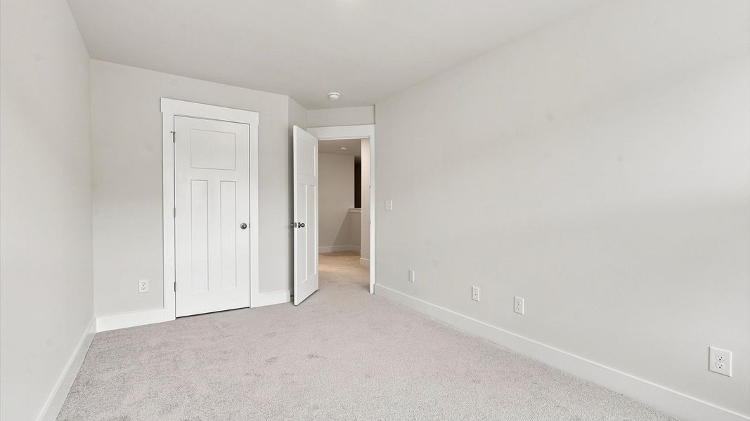 Memorable space offering plush carpet underfoot and a thoughtfully planned walk-in closet by DRB Homes Memorable space offering plush carpet underfoot and a thoughtfully planned walk-in closet by DRB Homes