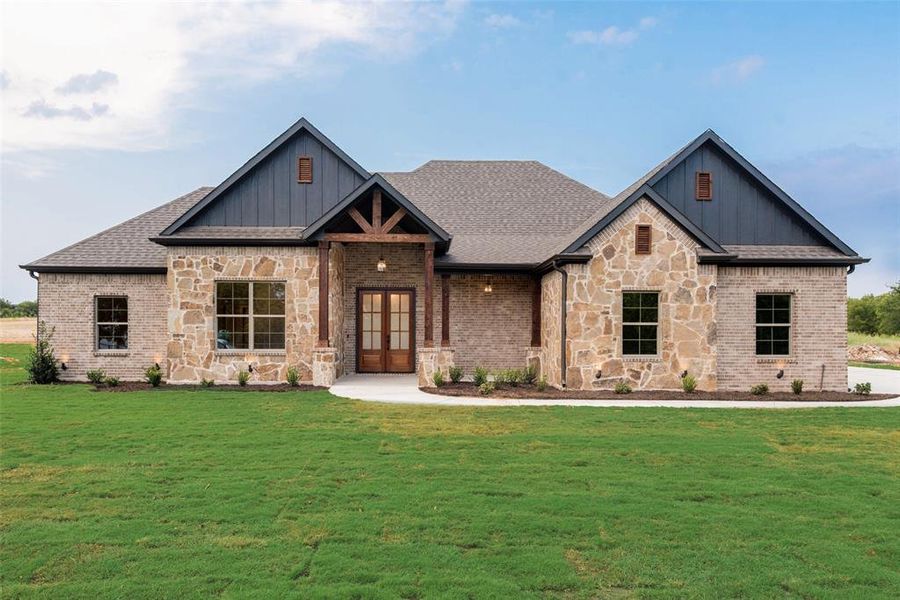 Craftsman-style house with board and batten siding, stone siding, a front lawn, and a porch Craftsman-style house with board and batten siding, stone siding, a front lawn, and a porch