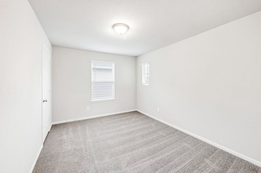 Representative unfurnished interior of a home built from the Floor Plan 1597 by Colina Homes in Rollingbrook Estates, Baytown (Image 25).