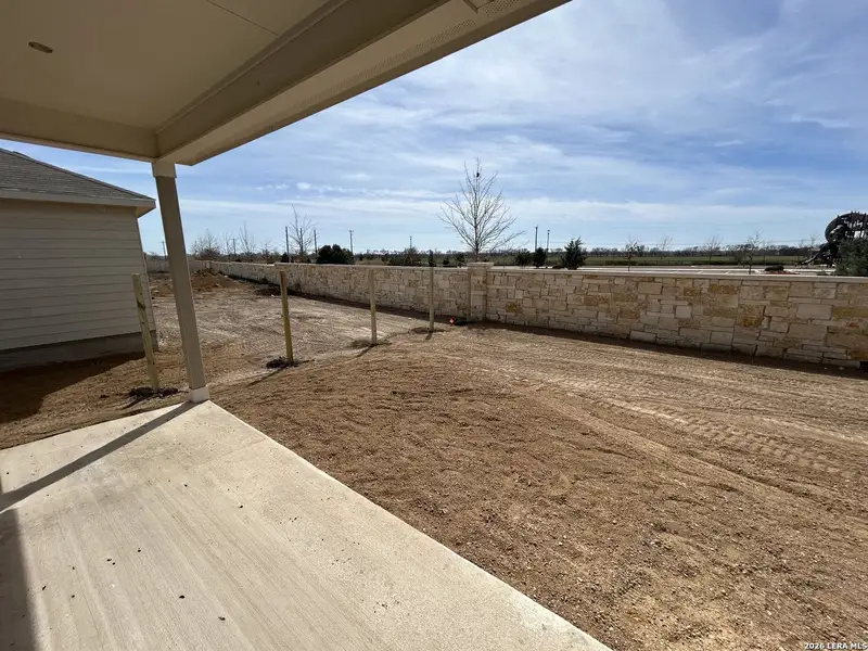 Exterior details and patio area of a home in Hennersby Hollow, San Antonio (Image 3).