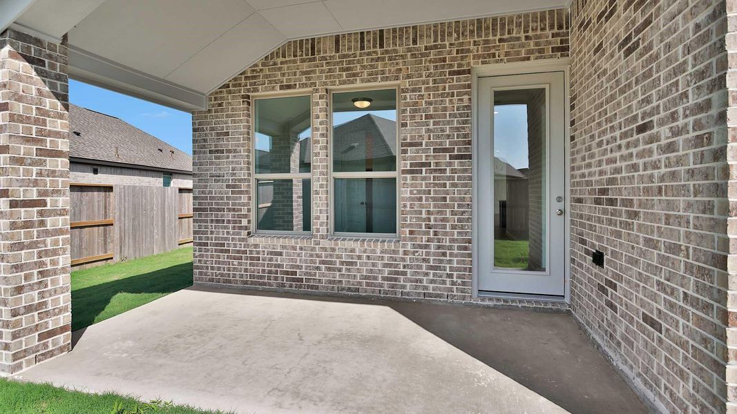 Exterior details and patio area of a home in Meridiana, Manvel (Image 2). Exterior details and patio area of a home in Meridiana, Manvel (Image 2).