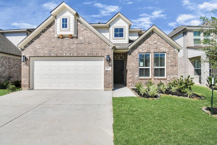 Front exterior of a new home in Telge Ranch, Cypress, TX, highlighting curb appeal (Image 21).