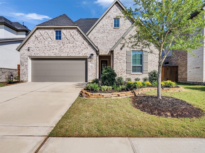Front exterior of a new home in Tompkins Reserve, Katy, TX, highlighting curb appeal (Image 24).