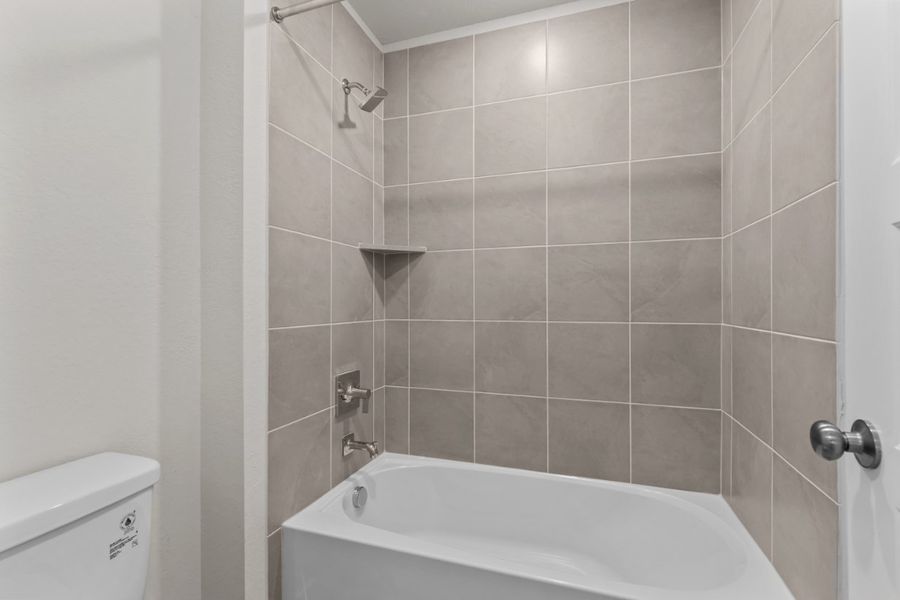 A bathtub in a bathroom. A bathtub in a bathroom.