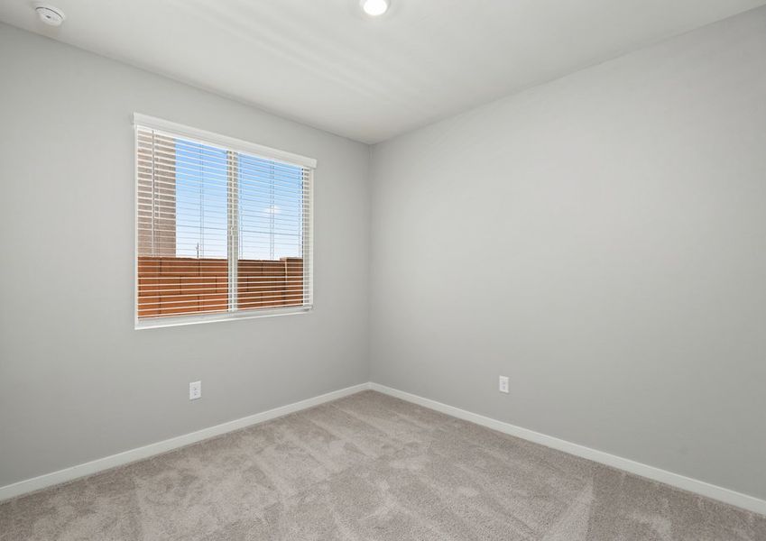Secondary bedrooms are filled with natural light.