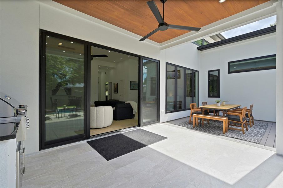 View of patio / terrace with outdoor dining area and a ceiling fan