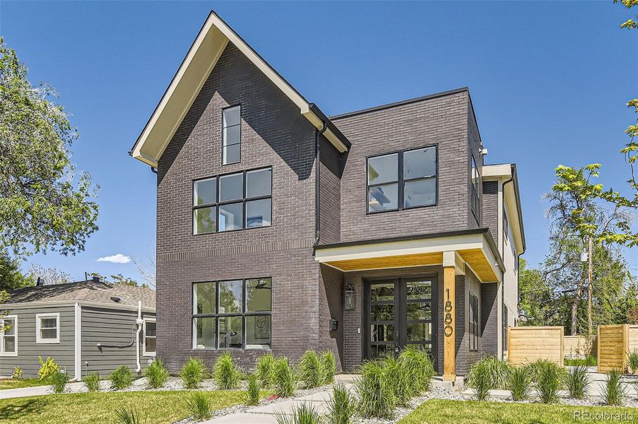 Front exterior of a new home in , Denver, CO, highlighting curb appeal (Image 22).
