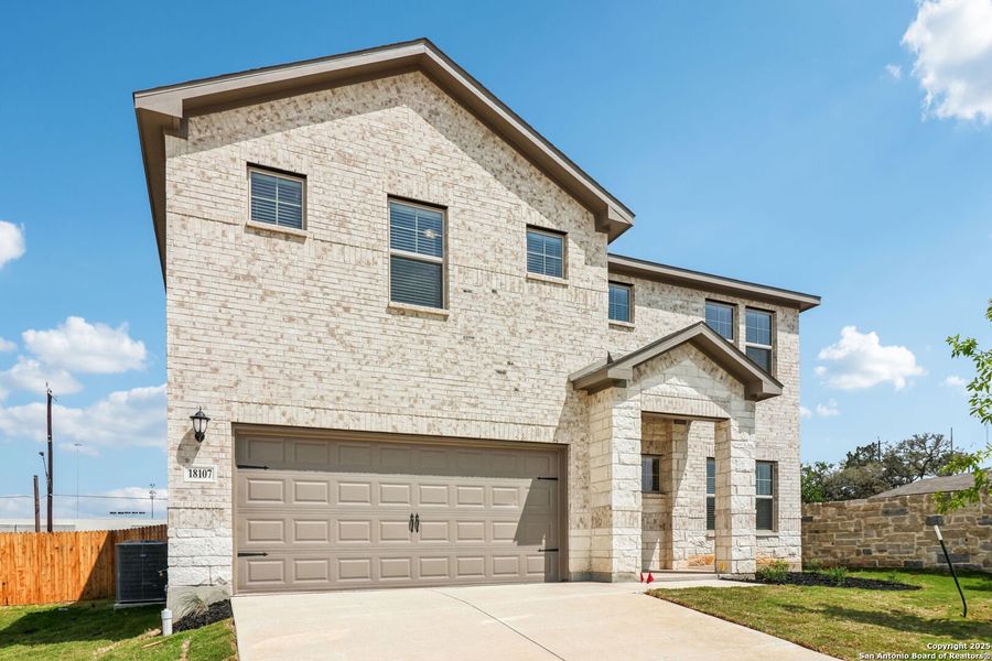 Front exterior of a new home in Autry Pond, San Antonio, TX, highlighting curb appeal (Image 20). Front exterior of a new home in Autry Pond, San Antonio, TX, highlighting curb appeal (Image 20).