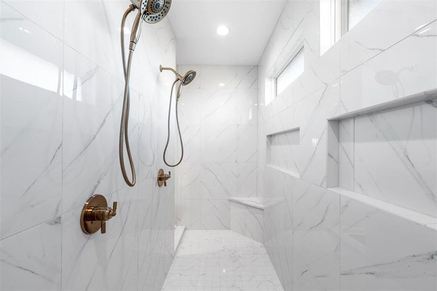 Full bath featuring a marble finish shower Full bath featuring a marble finish shower