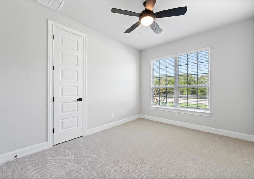 Spacious secondary bedrooms are found throughout the home.