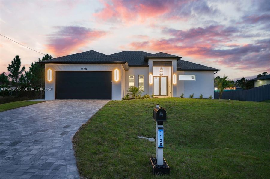 Front exterior of a new home in , Lehigh Acres, FL, highlighting curb appeal (Image 28).