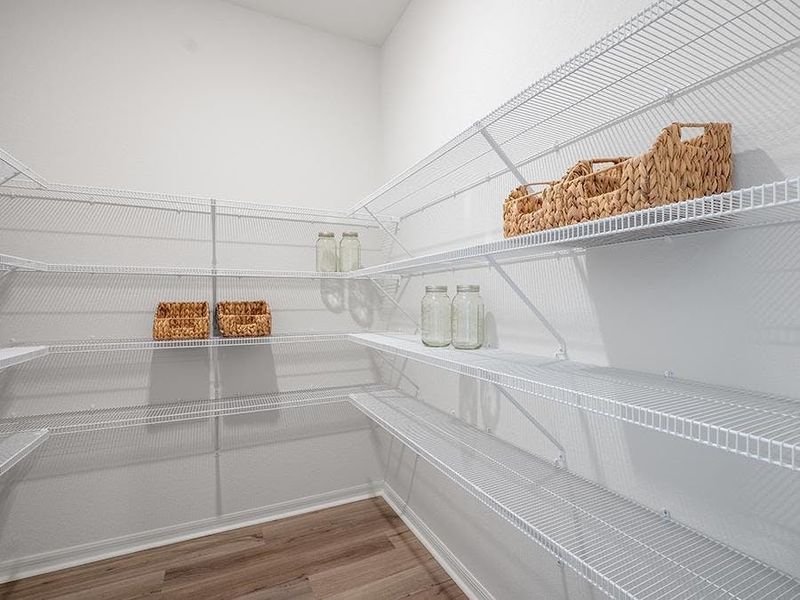 You will find convenient features throughout, such as this walk-in pantry - Monroe by Highland Homes
