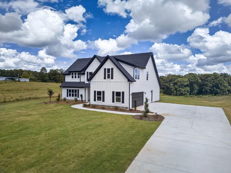 Front exterior of a new home in Blackwelder Bluff, Bowdon, GA, highlighting curb appeal (Image 30).