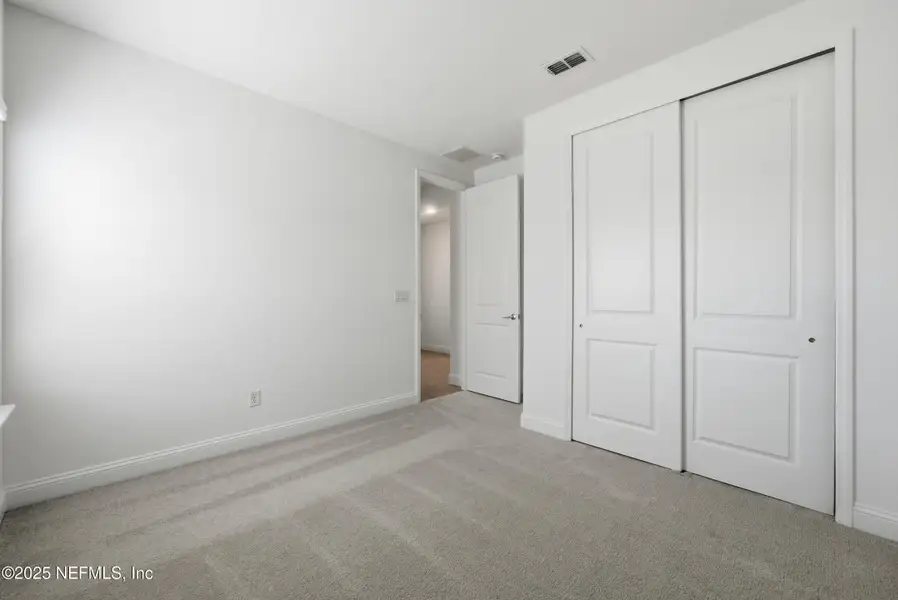 Spacious, unfurnished interior of a new home in Edenbrooke at Hyland Trail | 55+: Edenbrooke at Hyland Trail 60s, Green Cove Springs (Image 21). Spacious, unfurnished interior of a new home in Edenbrooke at Hyland Trail | 55+: Edenbrooke at Hyland Trail 60s, Green Cove Springs (Image 21).