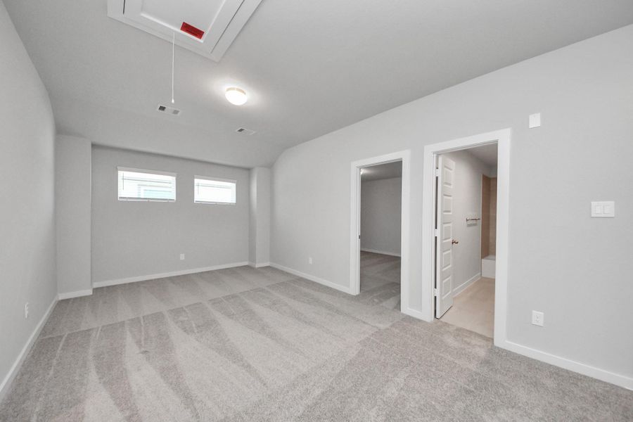 Discover a haven of leisure in this fantastic game room! Whether you're seeking a casual hangout or an adult gaming retreat, this space has it all. Enjoy the luxurious feel of plush carpet underfoot, the expansive ambiance of high ceilings, custom paint that adds a touch of personality, and windows that flood the room with refreshing natural light. Sample photo of completed home with similar floor plan. Actual colors and selections may vary. Discover a haven of leisure in this fantastic game room! Whether you're seeking a casual hangout or an adult gaming retreat, this space has it all. Enjoy the luxurious feel of plush carpet underfoot, the expansive ambiance of high ceilings, custom paint that adds a touch of personality, and windows that flood the room with refreshing natural light. Sample photo of completed home with similar floor plan. Actual colors and selections may vary.