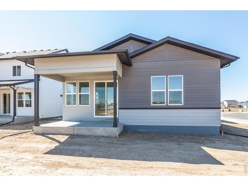 Exterior details and patio area of a home in Prairie Song Story Collection - Single Family Homes, Windsor (Image 27).