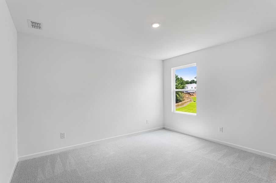 Representative unfurnished interior of a home built from the Avera by Taylor Morrison in Falls Creek, Flowery Branch (Image 28).