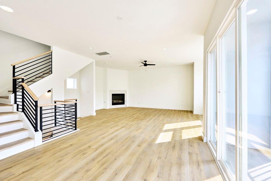 Bright and spacious, this open-concept living, dining, and kitchen area is perfect for entertaining. Featuring pristine quartz countertops, stainless steel appliances, and custom cabinetry, it’s a chef’s dream with plenty of space for hosting guests or enjoying family meals. Bright and spacious, this open-concept living, dining, and kitchen area is perfect for entertaining. Featuring pristine quartz countertops, stainless steel appliances, and custom cabinetry, it’s a chef’s dream with plenty of space for hosting guests or enjoying family meals.