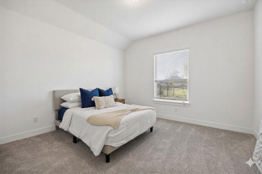 Another well-appointed secondary bedroom featuring a large window with blinds and upgraded carpeting. This bright, neutral space offers great flexibility for a guest room, children's room, or hobby space. Another well-appointed secondary bedroom featuring a large window with blinds and upgraded carpeting. This bright, neutral space offers great flexibility for a guest room, children's room, or hobby space.