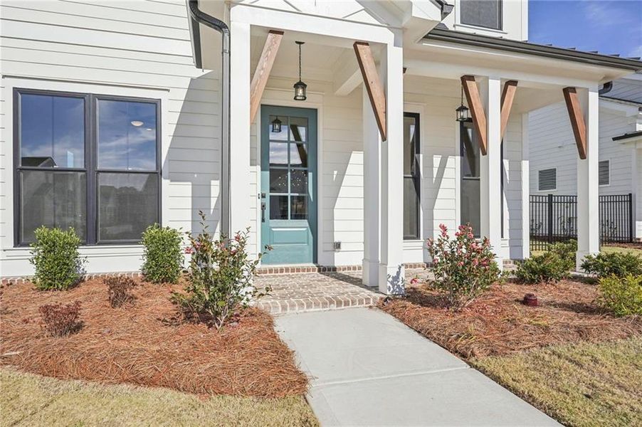 Exterior details and patio area of a home in Promenade at Sawnee Village, Cumming (Image 3).