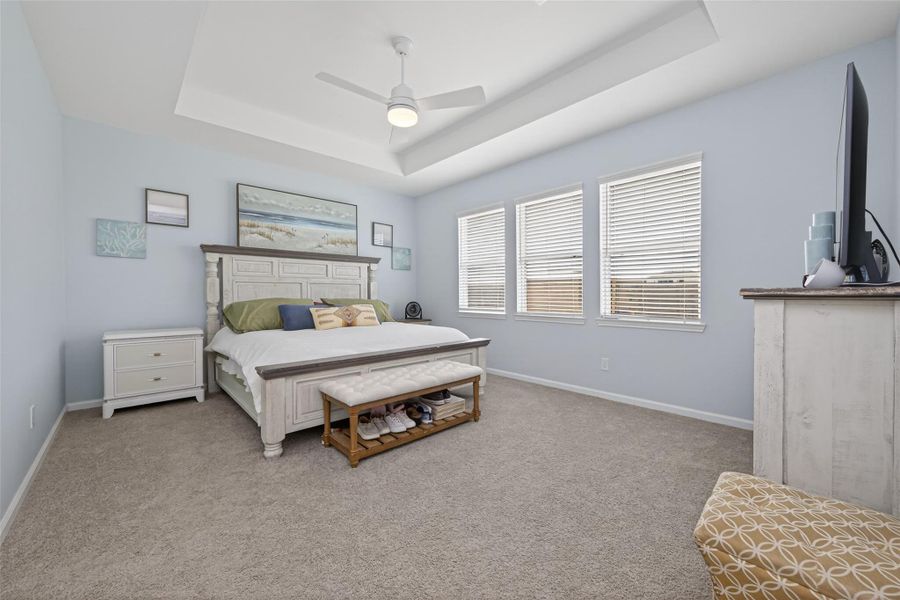 Well-sized primary bedroom with natural light, a comfortable layout, and an ensuite bathroom