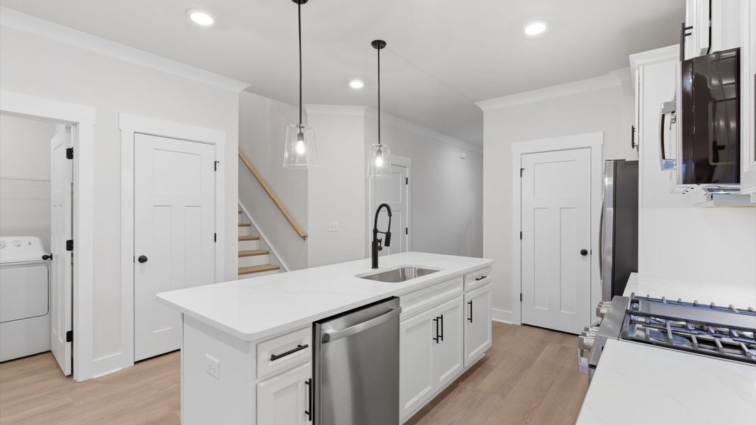 First-class finishes and a thoughtfully scaled island highlight this elegant kitchen space located in Greenville, SC
